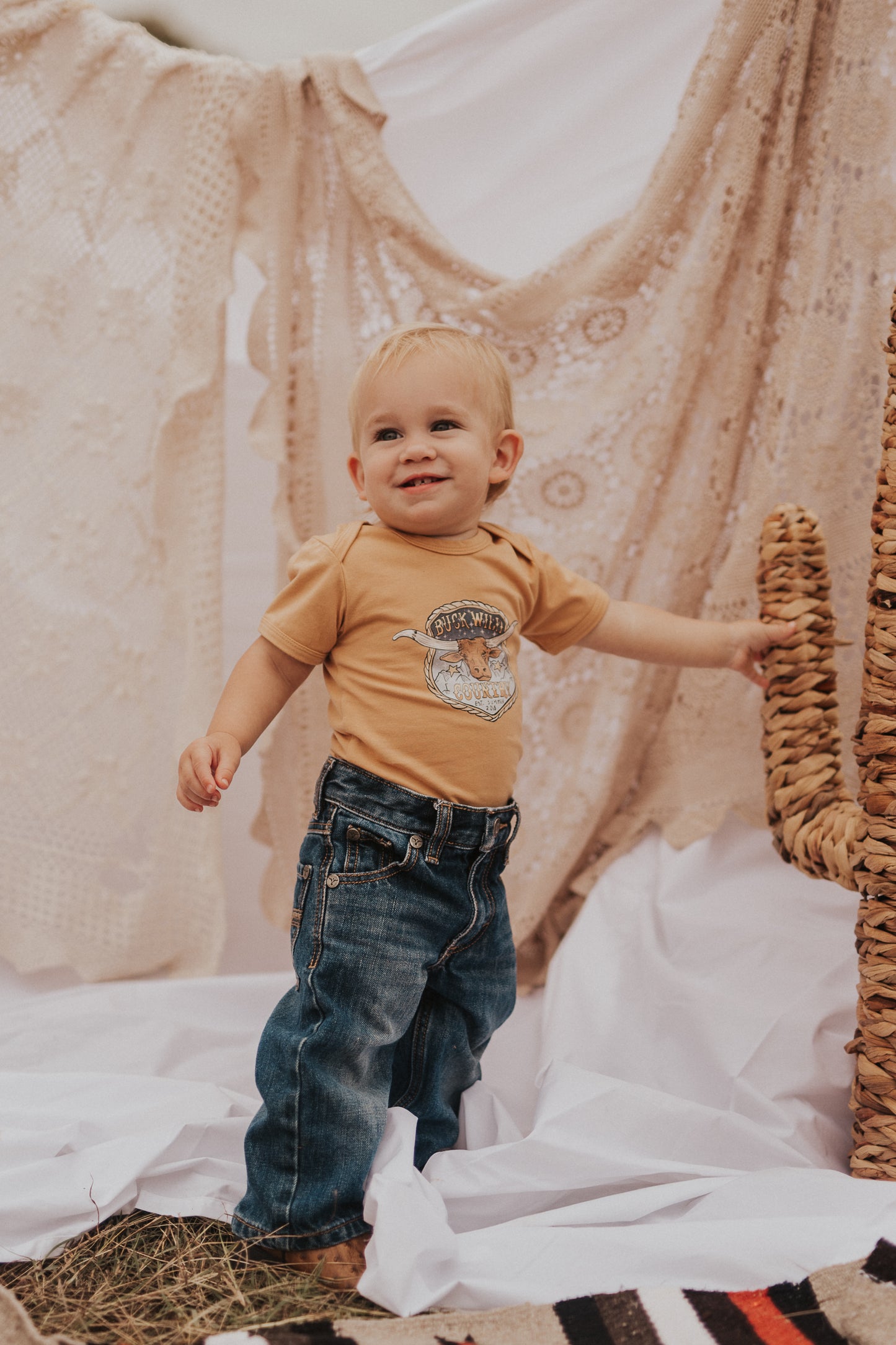 SHOOTOUT LITTLE BUCK ONESIE